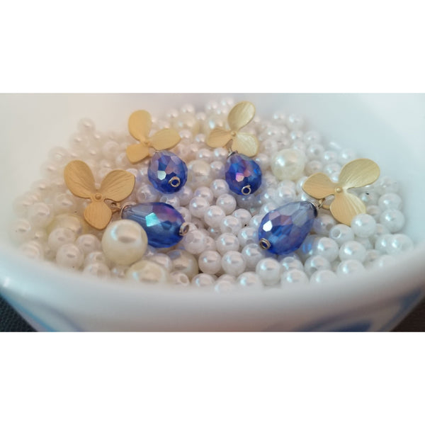 Matte golden flower with blue crystal teardrop earring